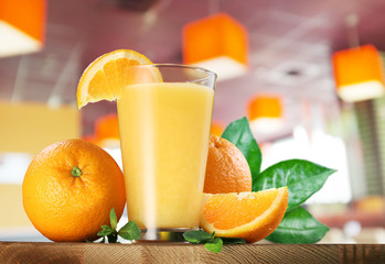 Orange fruits and glass of orange juice.