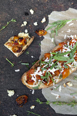 bruschetta with baked cherry tomatoes parmesan and rocket
