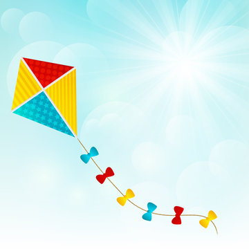 Color paper kite on sunny background
