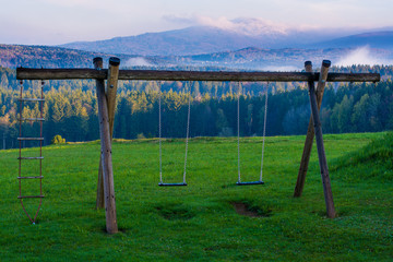 Fototapeta premium Teeterboard in the mountains landscape