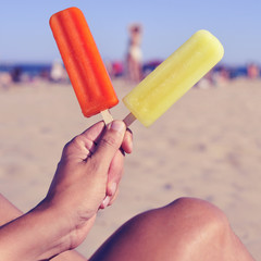 ice pops on the beach, with a filter effect