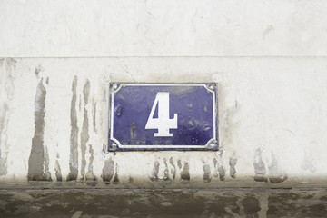 Number four on the wall of a house