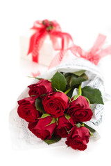 Roses and gift on white backgroung.