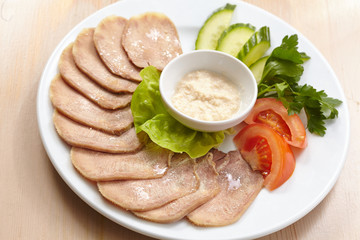 Slices of boiled beef tongue