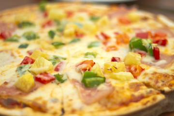 Pizza with sausage, tomatoes, mushrooms and cheese close up. bac