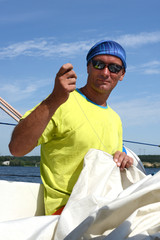 Man repairing sail