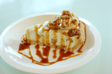 apple cheese pie decorated with apple topping