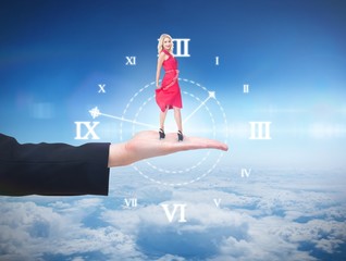 Composite image of smiling blonde turning