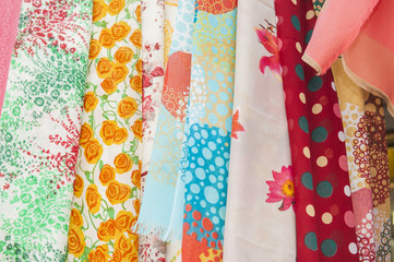 Fabrics hanging at a market stall