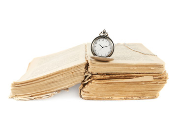 Pocket watch on the old book