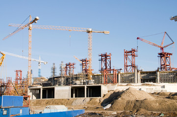 Fototapeta na wymiar buildings under construction with cranes