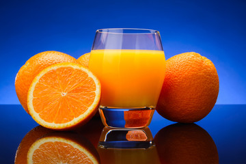 glass of Orange juice and oranges