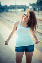 young beautiful long curly hair hipster woman