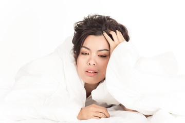 Portrait of a beautiful young woman in bed