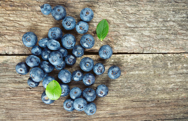 fresh blueberries on wooden surface