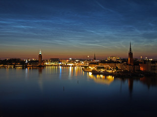 Fototapeta na wymiar Noctilucent clouds over Gamla stan, Stockholm, Sweden