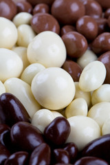 chocolate covered nuts and raisins background