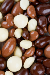 chocolate covered nuts and raisins background