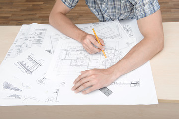 Two young architectures working at projective drawing