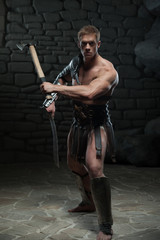 Fototapeta na wymiar Gladiator with sword and axe