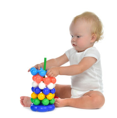 Infant child baby boy toddler playing with Pyramid in hand