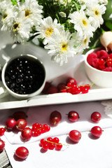 Still life with berries and flowers