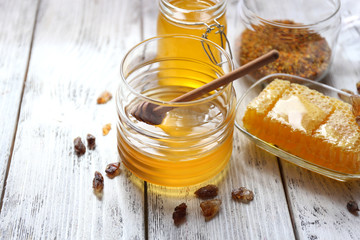 Fresh honey on wooden table