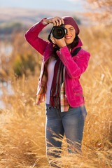 woman taking photos of winter wildness