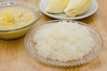 Durian and sticky rice on the wooden table
