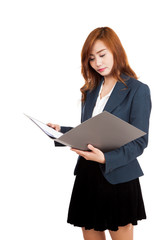 Asian office girl read data on folder