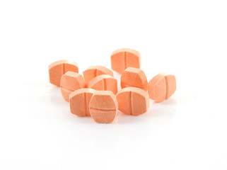 pill of vitamin C on white background