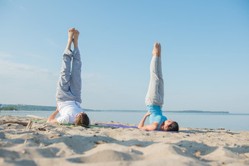 Young couple practicing yoga