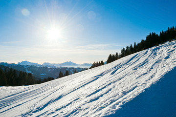 cold snow ski slope on Alps mountain, France