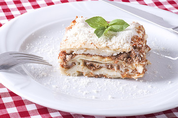 Lasagna served on a white plate
