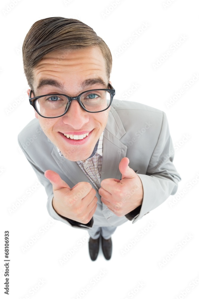 Poster Geeky hipster smiling at camera with thumbs up