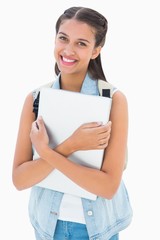 Naklejka premium Pretty student holding her laptop