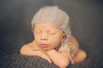 Newborn Baby Sleeping on Hands