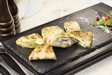 pita bread with vegetables on a plate in a restaurant