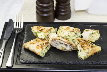 pita bread with vegetables on a plate in a restaurant