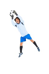 Fototapeta na wymiar Goalkeeper in blue saving ball