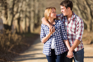 young couple walking in countryside