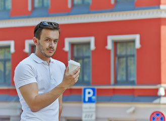 young man with cup of coffee