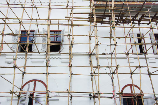 Wooden scaffolding around new building in Thailand