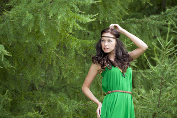 Beautiful young woman in green dress