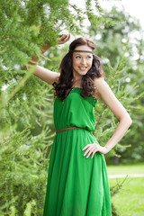 Beautiful young woman in green dress