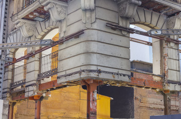 facade of old building in remodeling, retaining outside