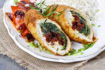 Chicken roll stuffed with spinach and dried tomatoes