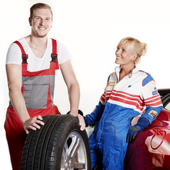 Woman with racing suit in a garage