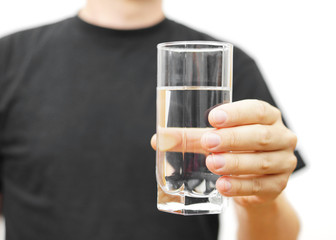 man offering a glass of water