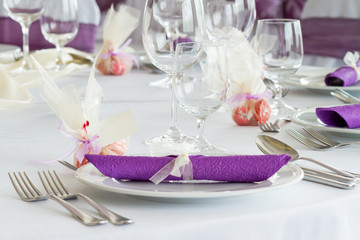 holiday table setting, purple napkin on plate - close up